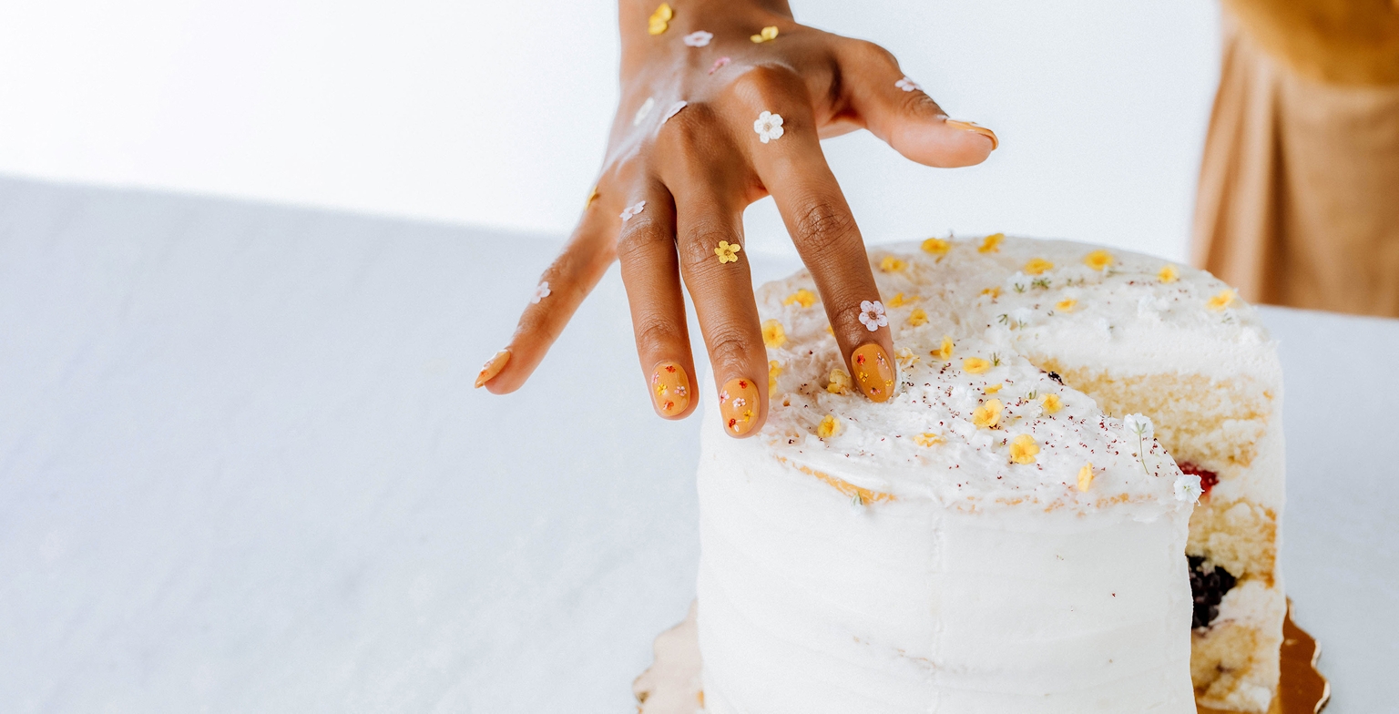 hand with cake
